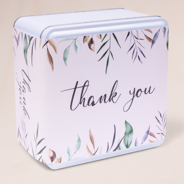 Delicate pink and water color leafs cookie tin with a thank you message. Baked and delivered home as a present by Carolina Cookie