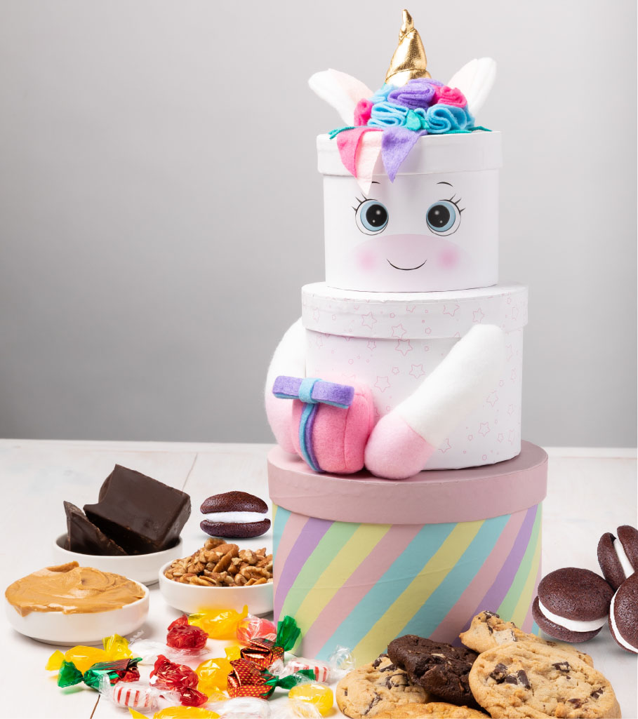 Colorful unicorn-themed cookie gift set by Carolina Cookie, adding a touch of magic to any occasion. Cookie delivery for unicorn lovers.
